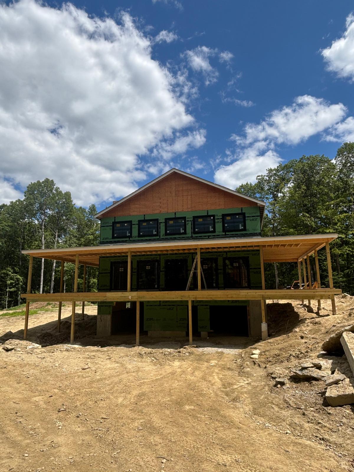 Front elevation of a new construction home with full porch