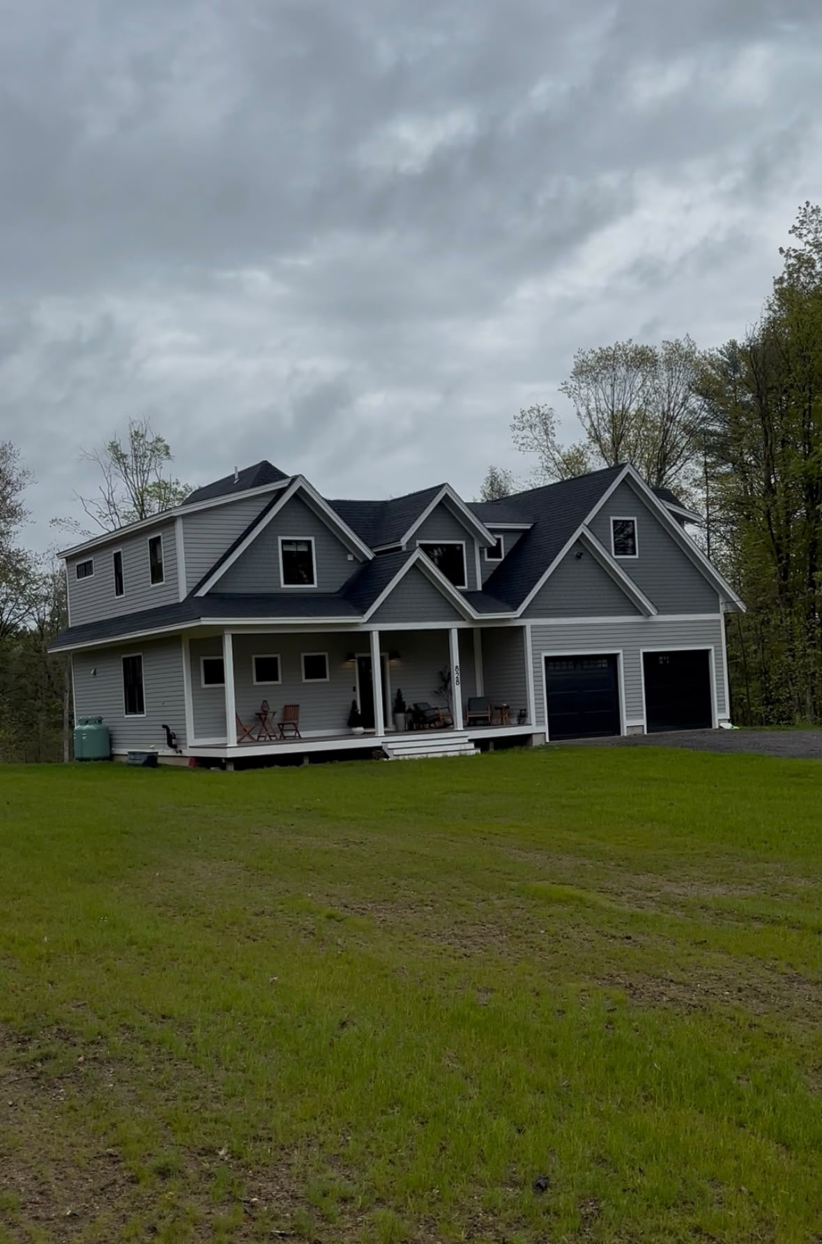 Completed custom home with farmer's porch and two-car garage